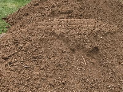 a photo of a pile of screened topsoil.